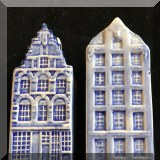 K36. Two sets of Delft house salt and pepper. - $12 each 